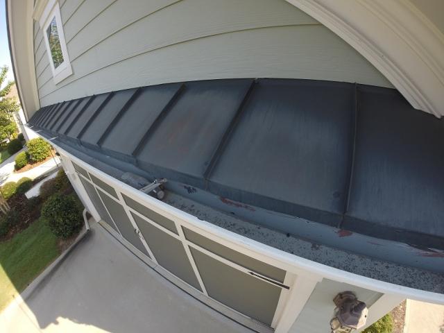 Gainesville Ga Inspector inspecting gutter and roof